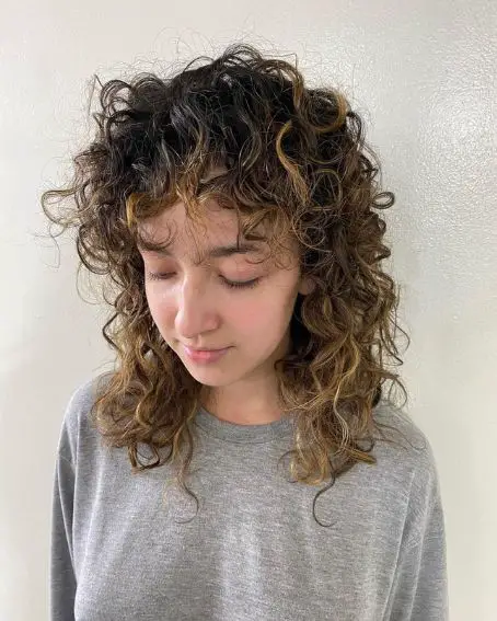 Wispy Bangs Curly Hairstyle