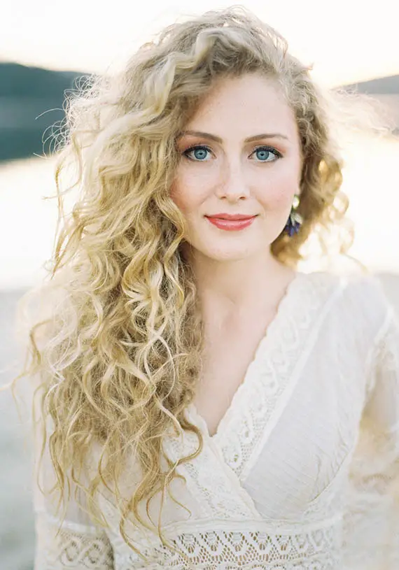 Long Curly Side Parted Blonde Hair