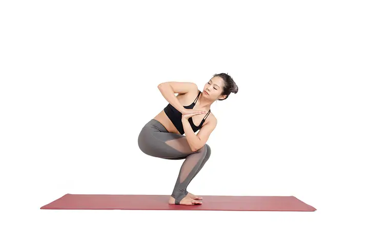 revolved chair pose for slim waist