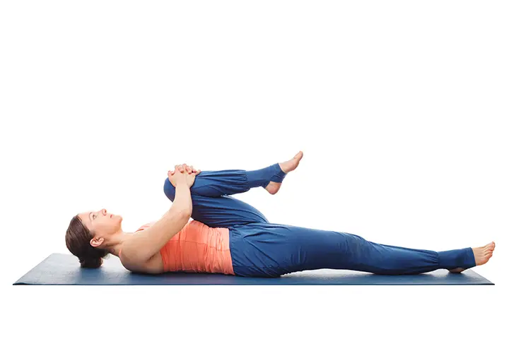 knee to chest pose for bloating
