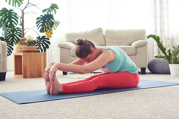 seated forward fold to boost fertility