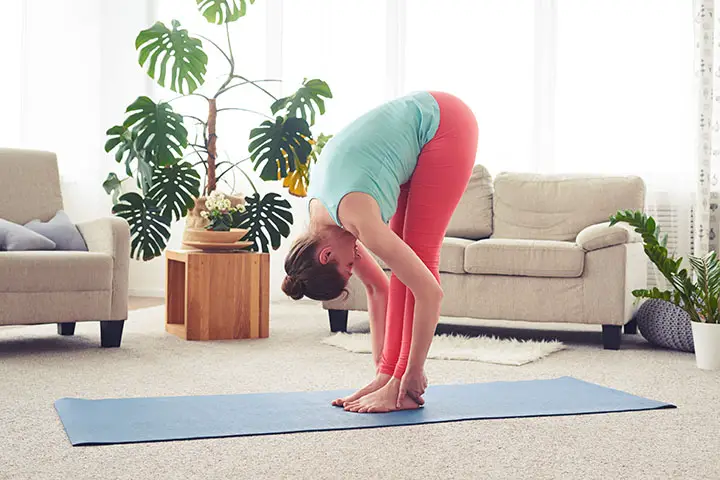 standing forward bend yoga to boost fertility