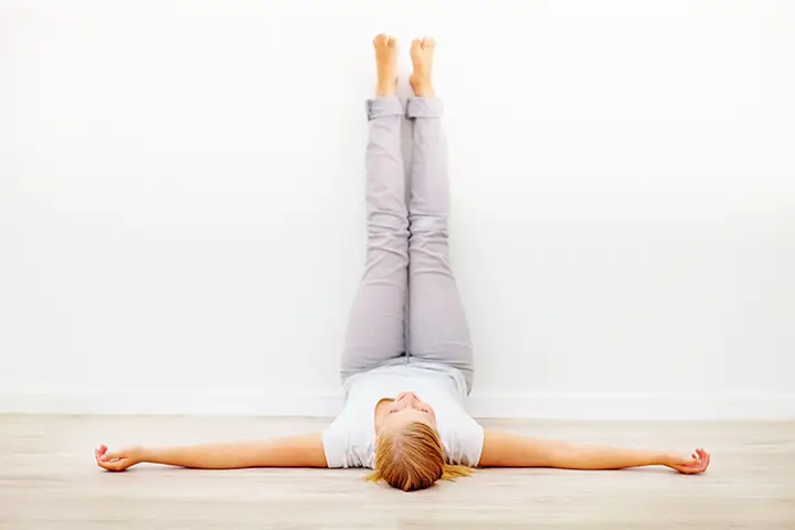 legs up the wall pose to combat fatigue