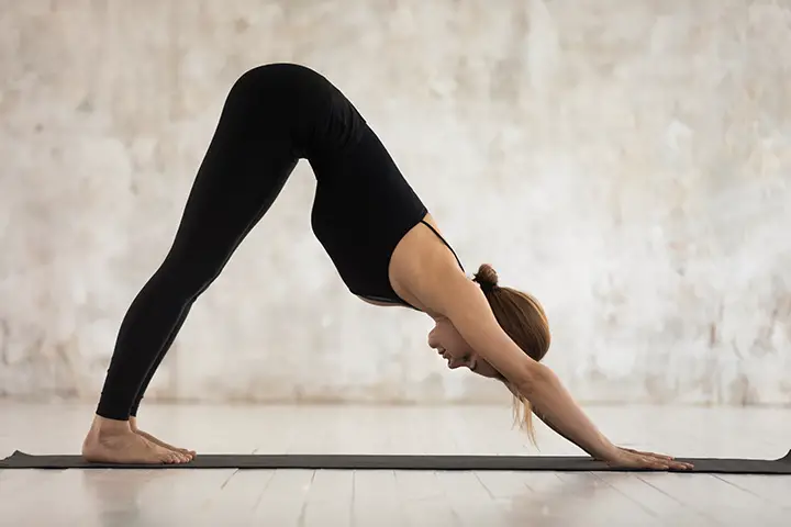 downward facing dog pose for flat stomach