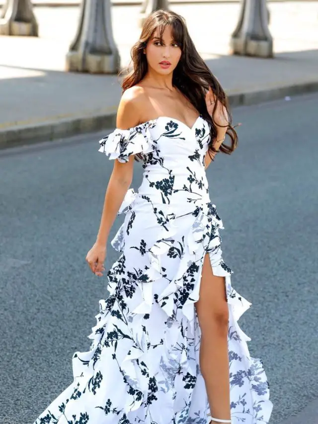 cropped-Nora-Fatehi-In-white-printed-floral-thigh-slit-dress.jpg
