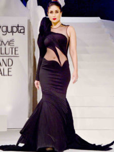 Modelling in a black designer bodycon dress on the ramp of Lakme fashion week