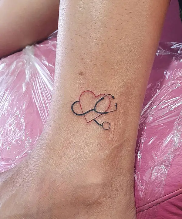 A Stethoscope Surrounding a Heart Tattoo