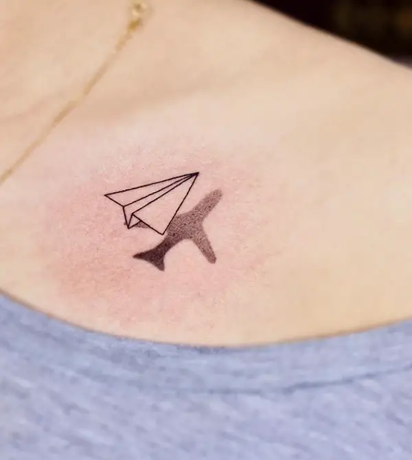 Airplane tattoo evolving with time, from a paper plane