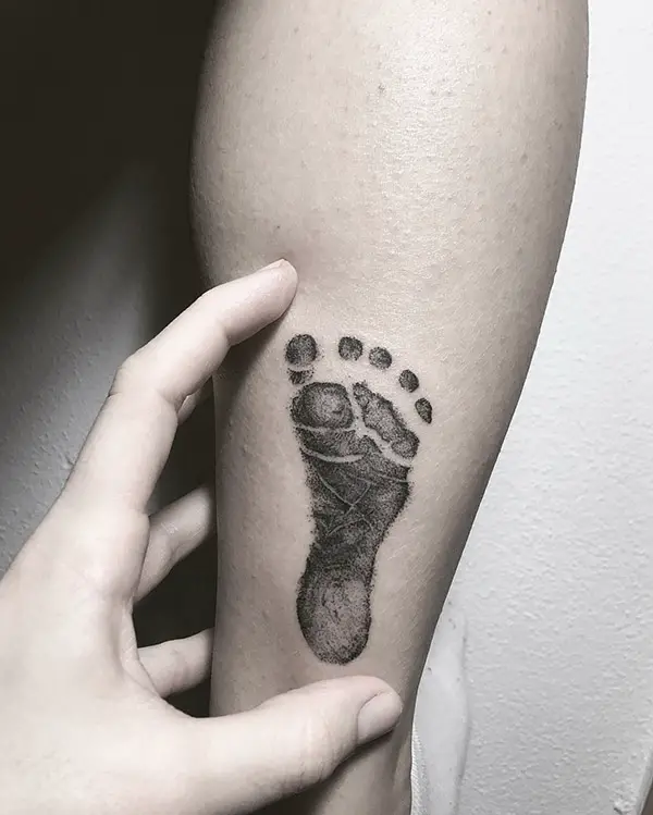 Black and White Baby Footprint Tattoo