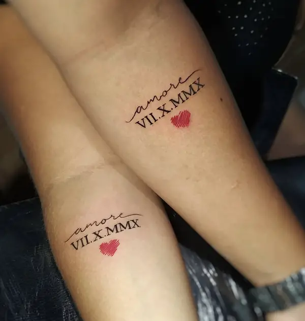 Roman numerals in a couple tattoo