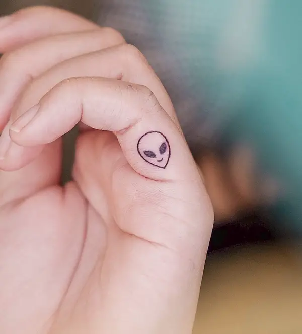 Tiny Alien Tattoo on Finger