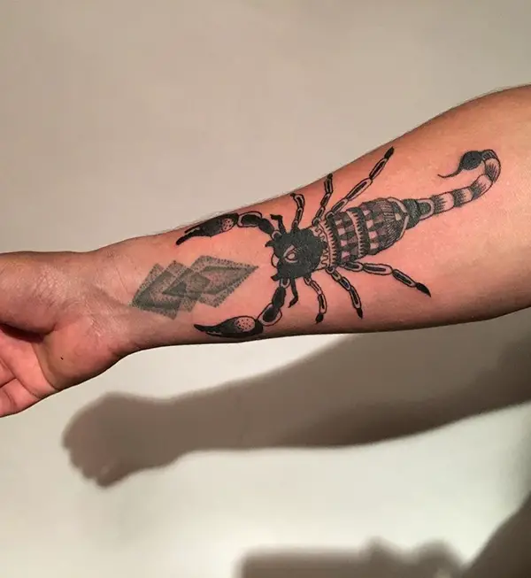 Black Ink Scorpion Tattoo on Hand