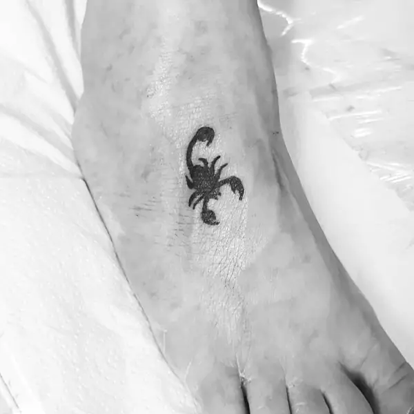 Minimal Black Scorpion Tattoo