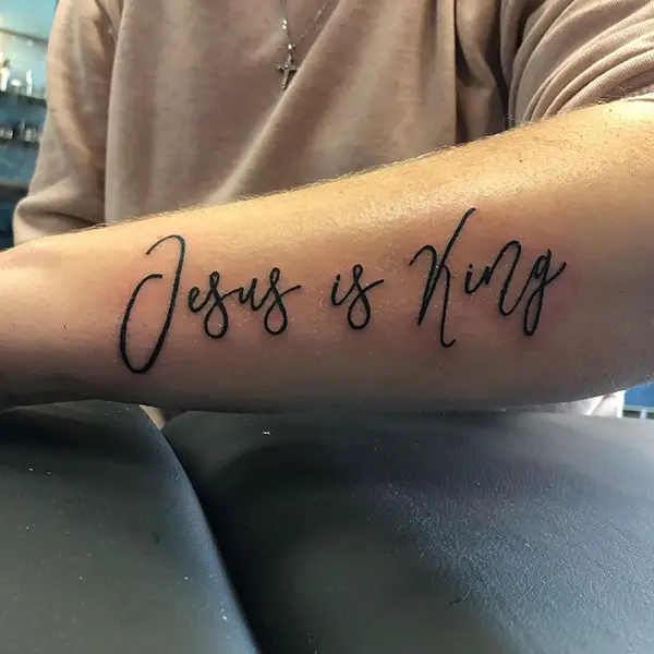 Jesus is King Inscription Tattoo