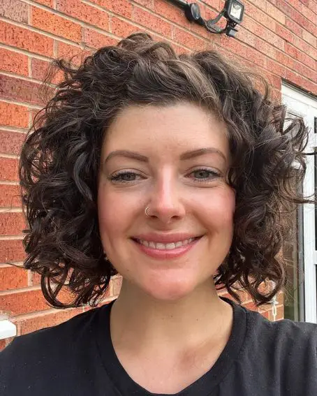 Short Hair with Light Curls and a Side Comb hairstyle For Women Over 50