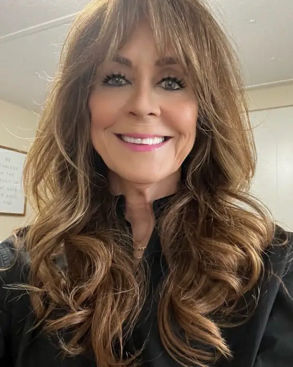 Long Waves with Side Bangs haircut For Women Over 50