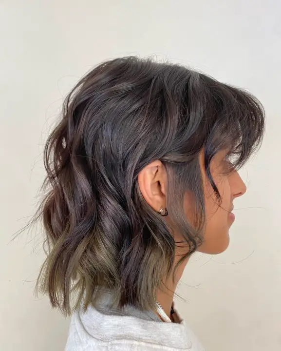 Multi-layered shag with feathered bangs haircut For Women Over 50