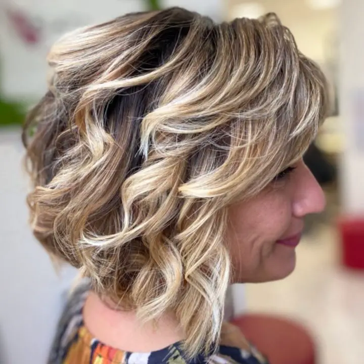 Thickly Layered Curly Tapered Bob haircut For Women Over 50