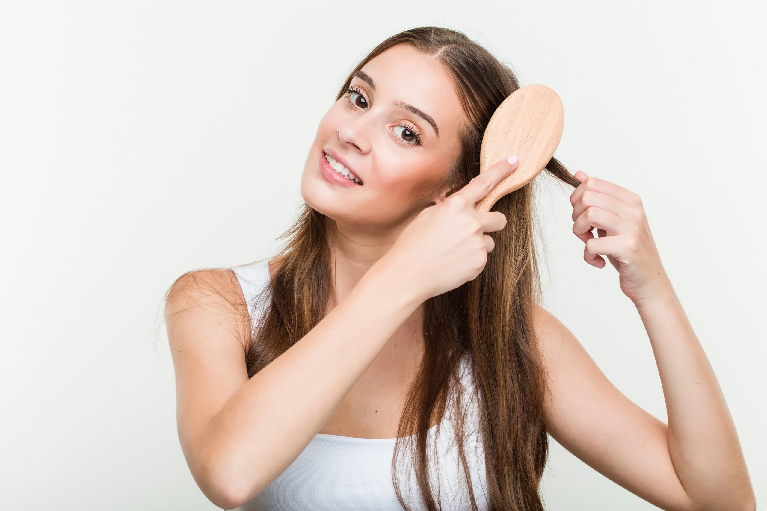 brushing her hair combing