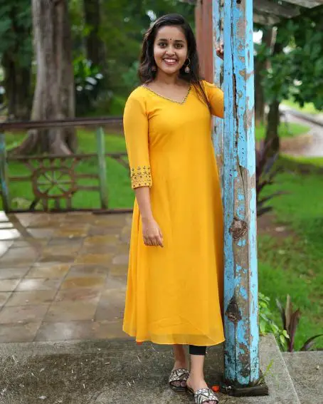 Plain Yellow Kurti with Simple Neck Design