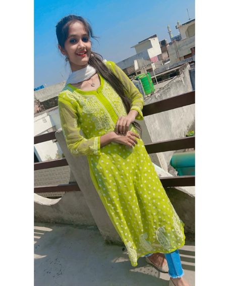 Transparent Sleeve Parrot Green Kurti with Blue Jeans