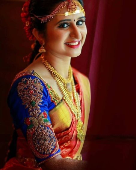 Bridal Blue Color Peacock design on Sleeve Blouse with Red saree