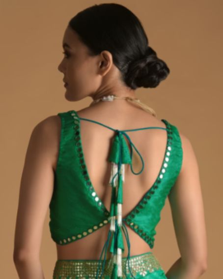 Dark Green Blouse In Raw Silk With Mirror Work And Open Back With Tassel Dori Tie Ups