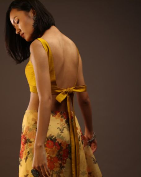 Pale Gold Sleeveless Blouse With A Sweetheart Neckline Back Lace With A Tie-Down