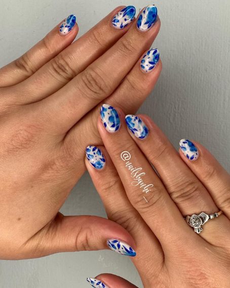 Blue and White Floral Nails with Claddagh Ring