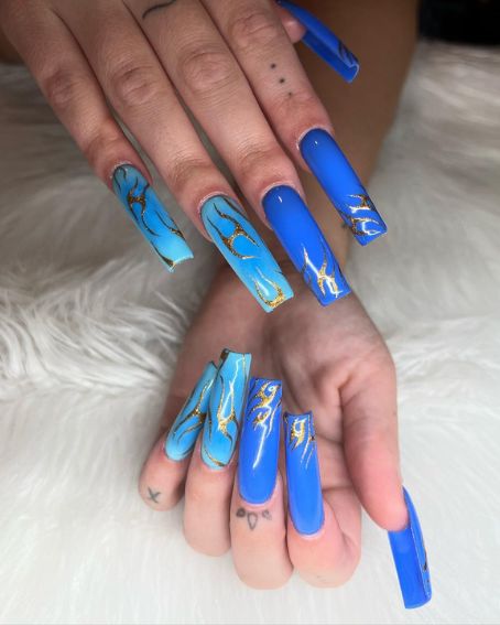 Blue and gold marble nails