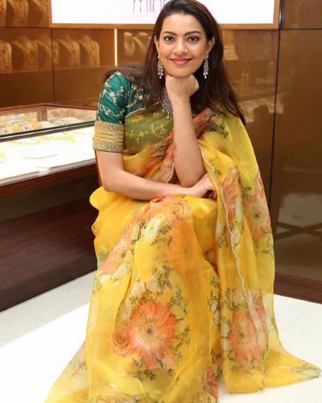 Decent Yellow Color Organza Base Saree With Green Blouse