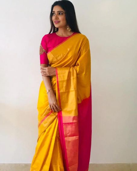 Elaborate Soft Silk Yellow Saree with Trendy Pink Blouse
