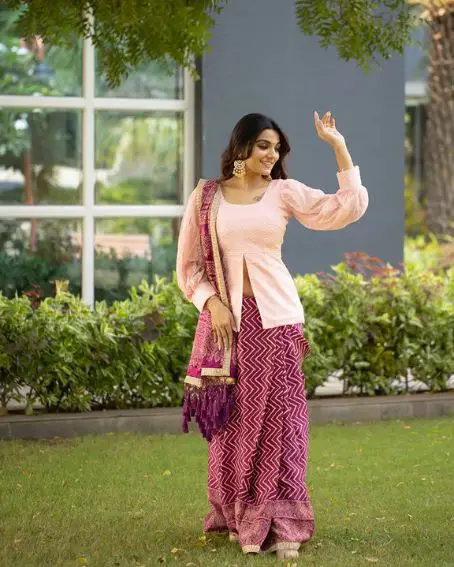 Exclusive Peach Color Peplum Blouse Design with Purple Skirt
