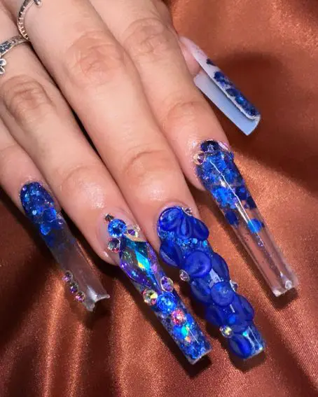 Nails with blue stones and flowers