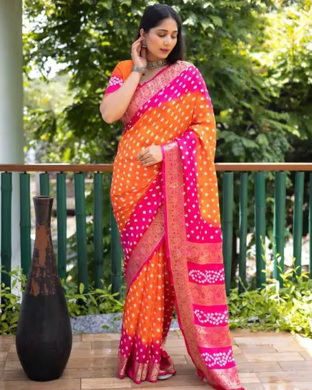 Orange and pink color bandhej silk saree with zari weaving work