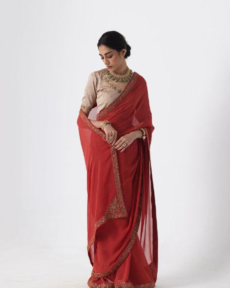 Red-Orange Georgette Saree Paired with Almond Satin Silk Blouse
