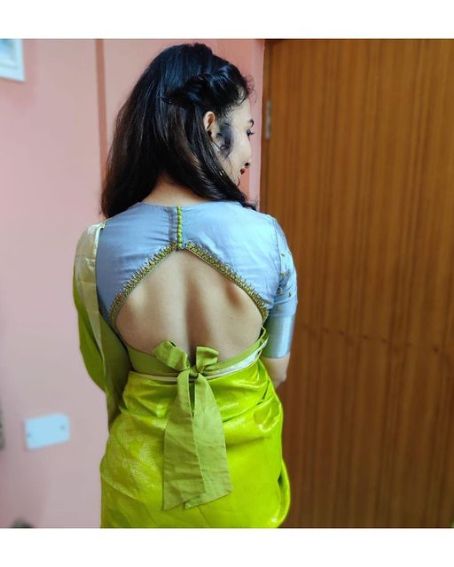 Sky Blue Color Bow Blouse Design with Green Saree Combination