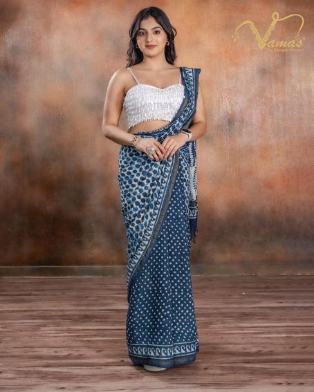 Sleeveless White Blouse with Blue Saree