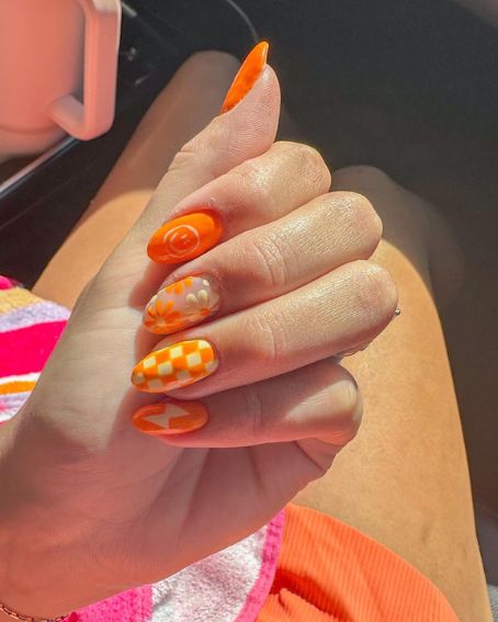 Smiley Face, Flowers, and Checkmate Orange Nail Designs