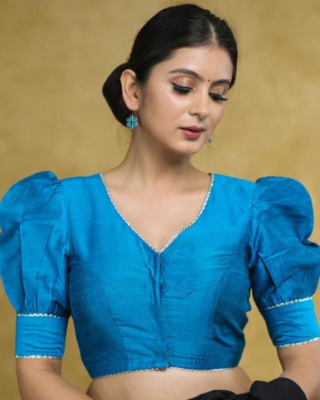 Striking Firozi Blue Puff Sleeveless Elbow Length Blouse