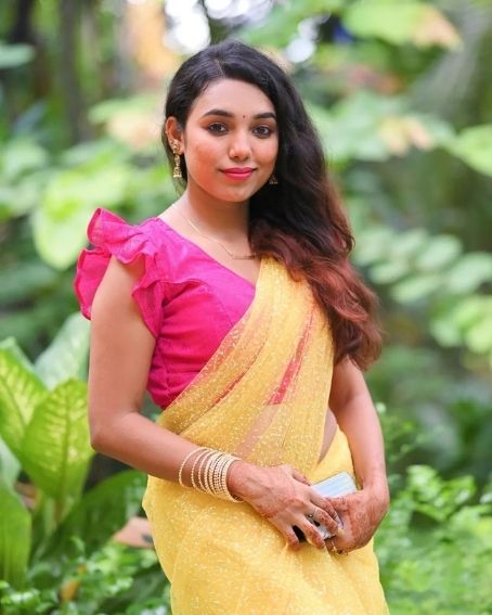 Yellow Color Saree with Pink Color Ruffle Style Blouse