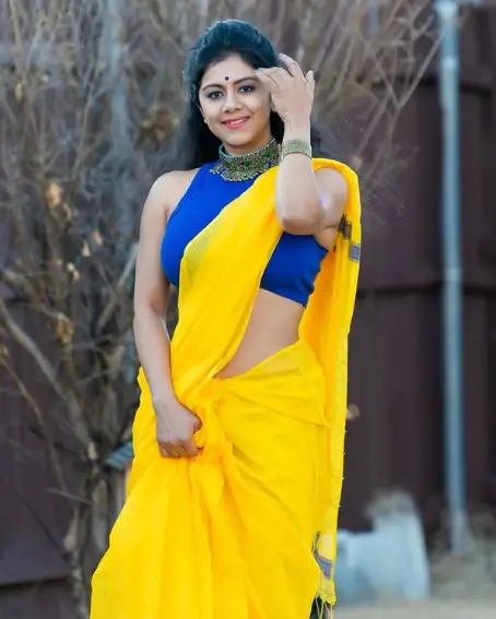 Yellow Plain Saree With Sleeveless Boat Neck Blouse