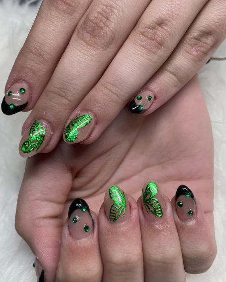 homecoming butterfly nails with black frenchies and gems!