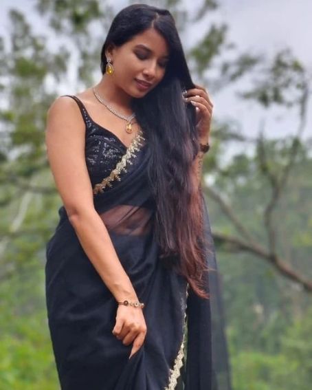 Black Silk Saree With Gold Border and Sleeveless Blouse