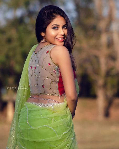 Green Net Saree with Net Embroidery Work Sleeveless Blouse