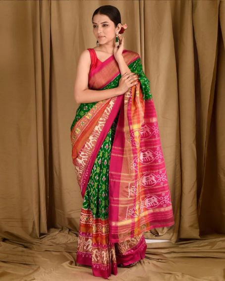 Green Patola Saree with Pink Sleeveless Blouse