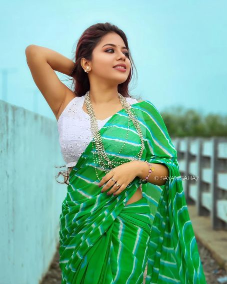 Green Stripes Saree with White Sleeveless Blouse