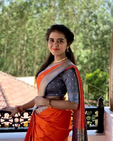 Orange Silk Saree With Gray Blouse