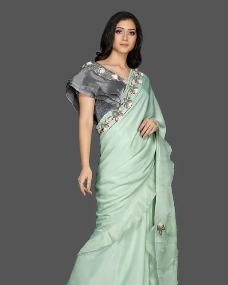 Pastel Green Ruffle Sari With Gray Blouse