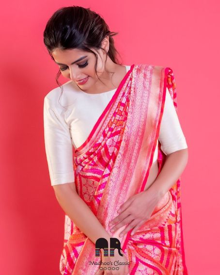 Pink Banarasi Saree by Madhoo’s Classic Paired with Contrasting White Blouse